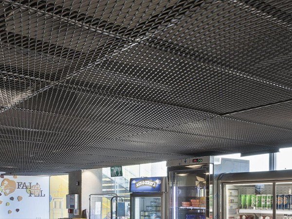 Decorative expanded metal is installed on the ceilings as vents and decoration.