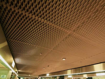 Copper expanded metal used as ceilings of a building.