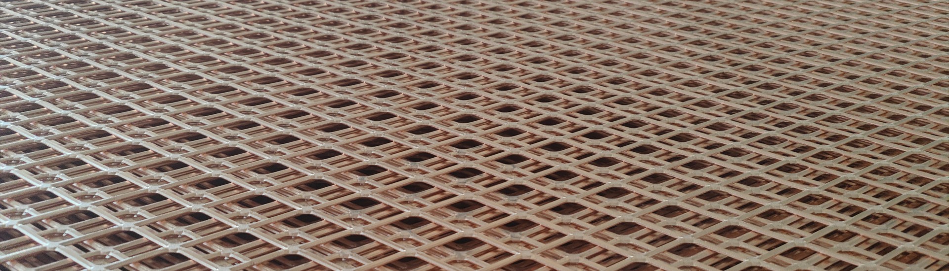 Copper expanded metal mesh laid flat on the ground