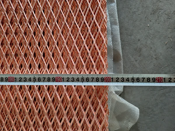Measure the length of the copper expanded metal sheet with a tape.