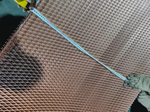 Measure the dimensions of the copper expanded metal sheet with a tape.