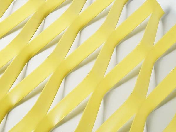 Yellow steel mesh stainless steel ceiling on a white background.