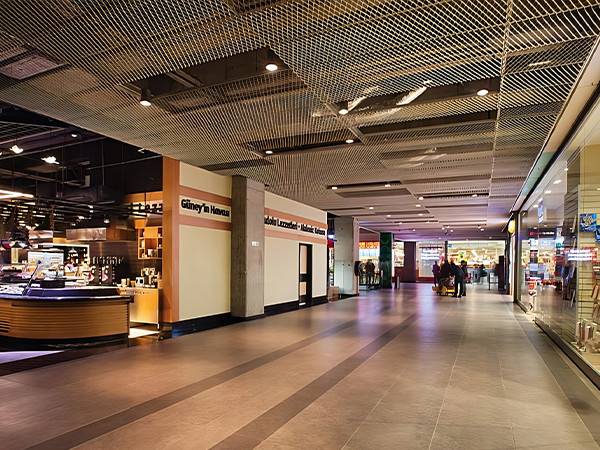 Expanded mesh ceiling installed above the mall corridor