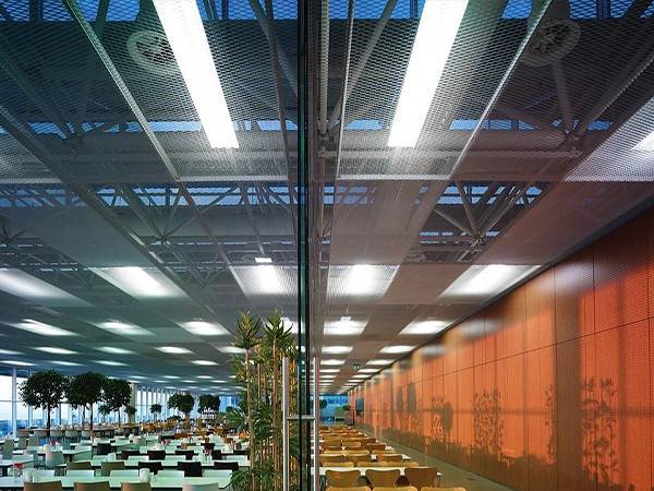 Restaurant ceiling adorned with expanded metal sheet.