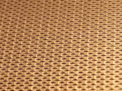 A sheet of micro expanded metal made from copper is in the picture.