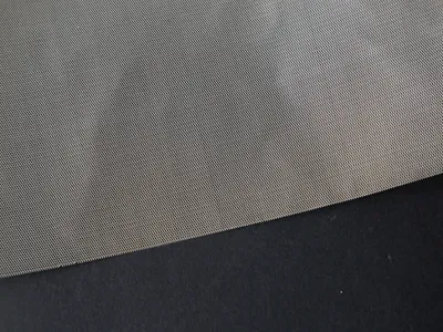 Stainless steel micro expanded metal on a black background