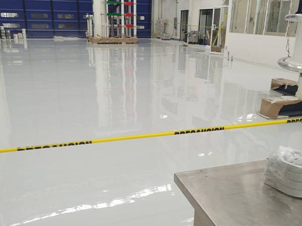 Apply an epoxy coating to the concrete floor